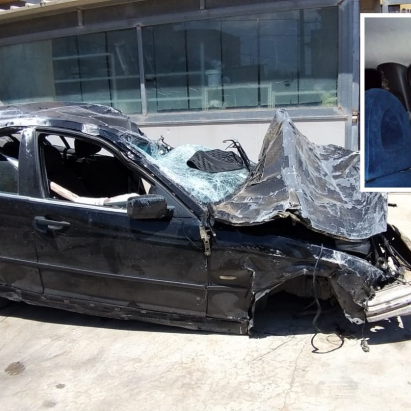 Fabio Provenzano e l'auto distrutta dopo l'incidente