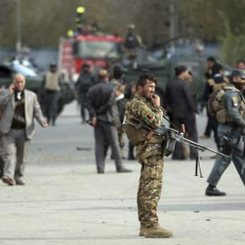 Security forces inspect the site of a deadly blast near a demonstration by hundreds of minority Shiites, in the center of Kabul, Afghanistan, Monday, Nov. 12, 2018. Afghan officials confirmed several people were killed in the explosion near a high school and about 500 meters (yards) from where people gathered to denounce Taliban attacks in Jaghuri and Malistan districts of eastern Ghazni province. (ANSA/AP Photo/Massoud Hossaini) [CopyrightNotice: Copyright 2018 The Associated Press. All rights reserved.]