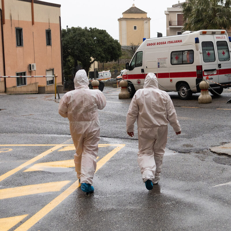Two nurses move outside the hospital moving from the wards, always protected by a suit, gloves and mask to avoid any infections from the Coronavirus (COVID-19).