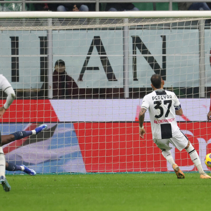 Udinese's Roberto Pereyra scores on penalty goal of 0 to 1 against AC Milans goalkeeper Mike Maignan during the Italian serie A soccer match between AC Milan and Udinese at Giuseppe Meazza stadium in Milan, 4 November 2023.ANSA / MATTEO BAZZI