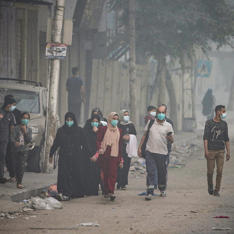 epa10964810 Residents flee from Al Shatea refugee camp during direct direct combat between the Israeli army and militants of the Ezz Al-Din Al Qassam militia, the military wing of the Hamas movement, at the beach road in west-centre Gaza City, 08 November 2023. More than 10,000 Palestinians and at least 1,400 Israelis have been killed, according to the Israel Defense Forces (IDF) and the Palestinian health authority, since Hamas militants launched an attack against Israel from the Gaza Strip on 07 October, and the Israeli operations in Gaza and the West Bank which followed it. EPA/MOHAMMED SABER