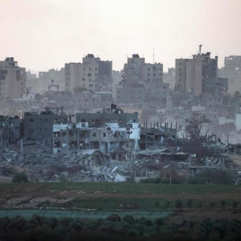 This picture taken on November 9, 2023 from a position along the border with the Gaza Strip in southern Israel, shows a view of destroyed buildings in Gaza amid ongoing battles between Israeli forces and the Palestinian Hamas movement. (Photo by Menahem KAHANA / AFP)