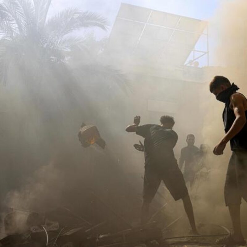 Palestinians check the rubble of a building in Khan Yunis on November 6, 2023, amid the ongoing battles between Israel and the Palestinian group Hamas. Thousands of civilians, both Palestinians and Israelis, have died since October 7, 2023, after Palestinian Hamas militants based in the Gaza Strip entered southern Israel in an unprecedented attack triggering a war declared by Israel on Hamas with retaliatory bombings on Gaza. (Photo by Mahmud HAMS / AFP)