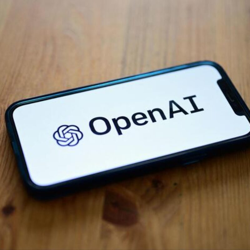 (FILES) A photo taken on October 4, 2023 in Manta, near Turin, shows a smartphone displaying the logo of the artificial intelligence OpenAI research laboratory. Hundreds of staff at ChatGPT's parent company OpenAI have signed a letter threatening to leave the tech firm unless "all current board members resign," according to US media reports on November 20, 2023. (Photo by MARCO BERTORELLO / AFP)