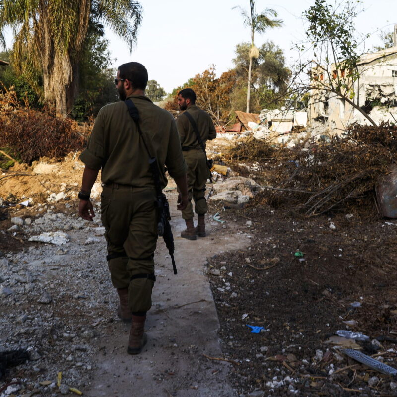 epa10924169 Israeli soldiers walk near destroyed houses during a guided visit of the media to the destroyed Be'eri Kibbutz, Israel, 17th October 2023, which was attacked by Hamas on 07 October. Israel has warned all citizens of the Gaza Strip to move to the south ahead of an expected invasion. More than 3,000 Palestinians and 1,400 Israelis have been killed according to the Israel Defense Forces (IDF) and Palestinian Health Ministry, after Hamas militants launched an attack against Israel from the Gaza Strip on 07 October. EPA/MANUEL DE ALMEIDA