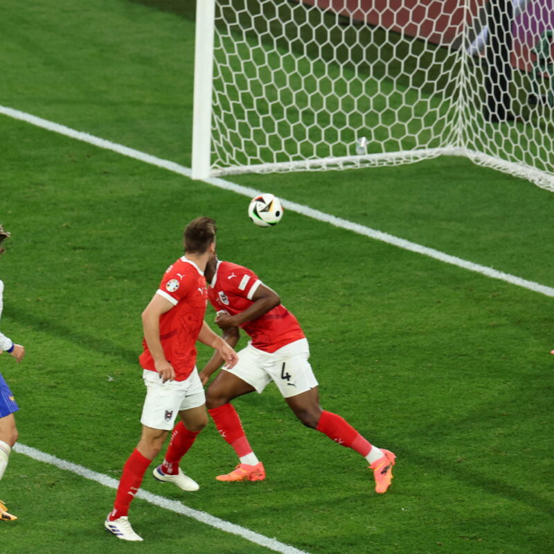 epa11418762 A ball from Kylian Mbappe of France (usneen) deflects on Maximilian Wober of Austria to score an own goal making it 0-1 during the UEFA EURO 2024 group D soccer match between Austria and France, in Dusseldorf, Germany, 17 June 2024. EPA/GEORGI LICOVSKI