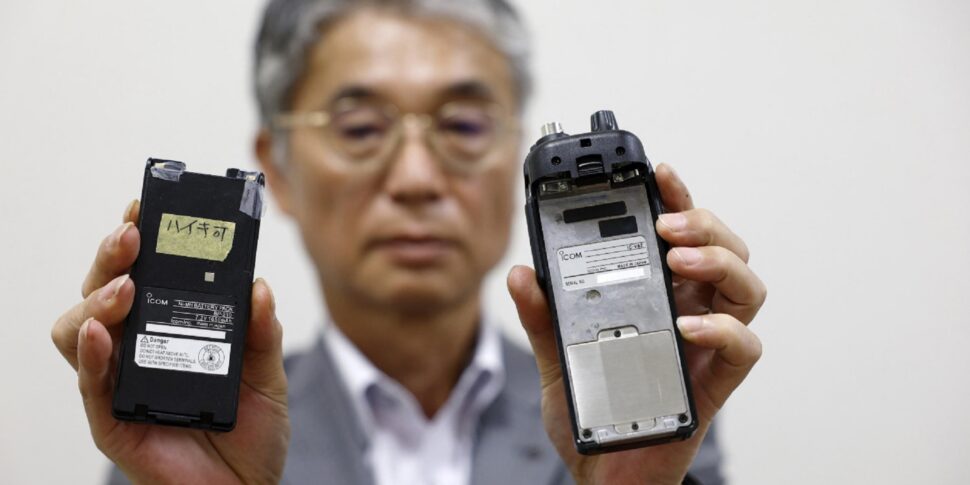 https://assets.gazzettadelsud.it/2024/09/Japanese-walkie-talkie-maker-Icom-Inc.-director-Yoshiki-Enomoto-shows-its-radio-model-IC-V82-device-and-its-battery-L-at-the-company-head-office-in-Osaka-western-Japan-970x485.jpg